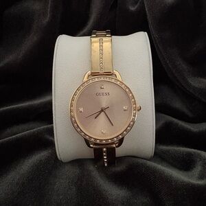 Guess Gold-Tone Crystal Analog Watch. Style #: 14061383